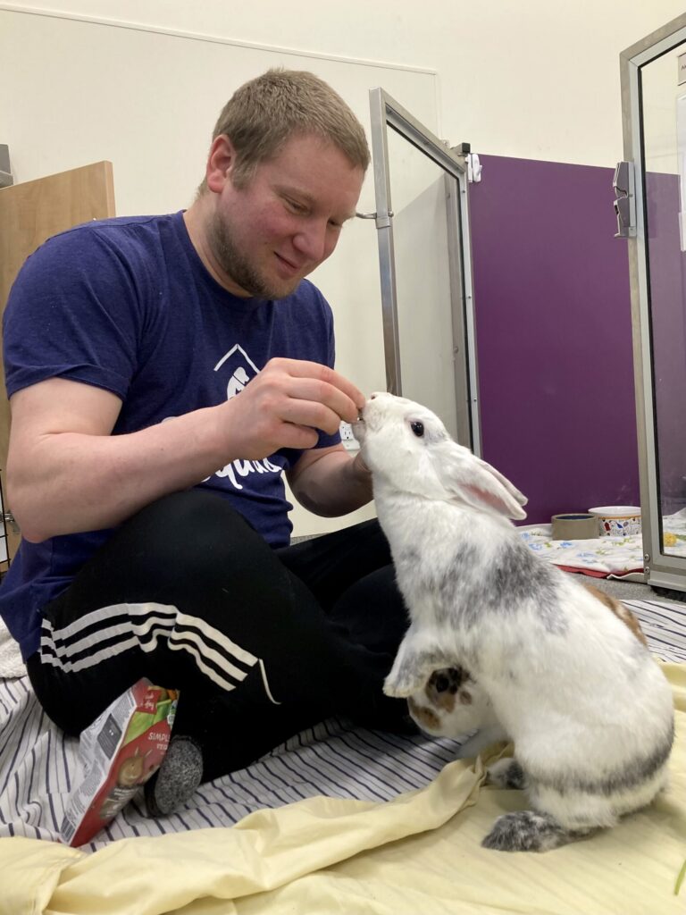 Brian Redden, Small Animal Socializer/Cleaning Volunteer, with Bean.